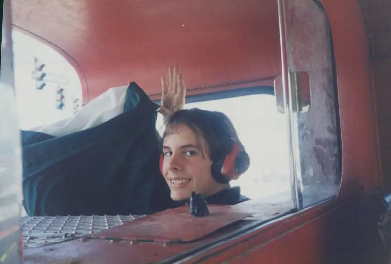 Child waving from the cab of a fire truck – Birthday Parties in Orlando, FL