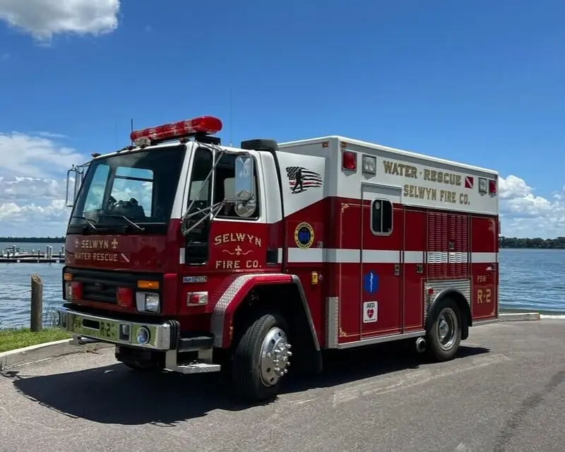 Red and white rescue truck parked by the water – Weddings in Orlando, FL