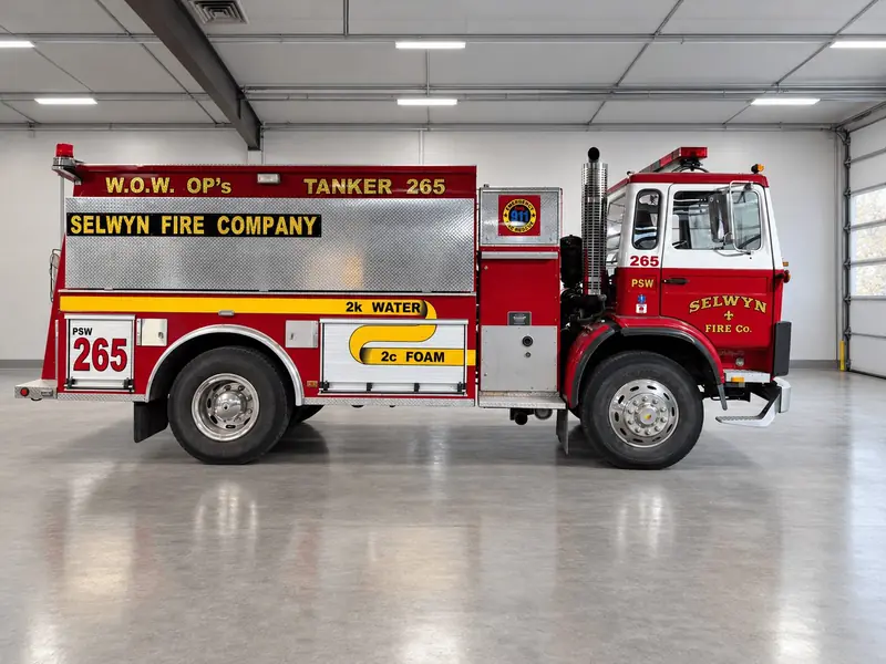 Side view of red fire tanker 265 Water on Wheels – 1st Due fire truck fleet