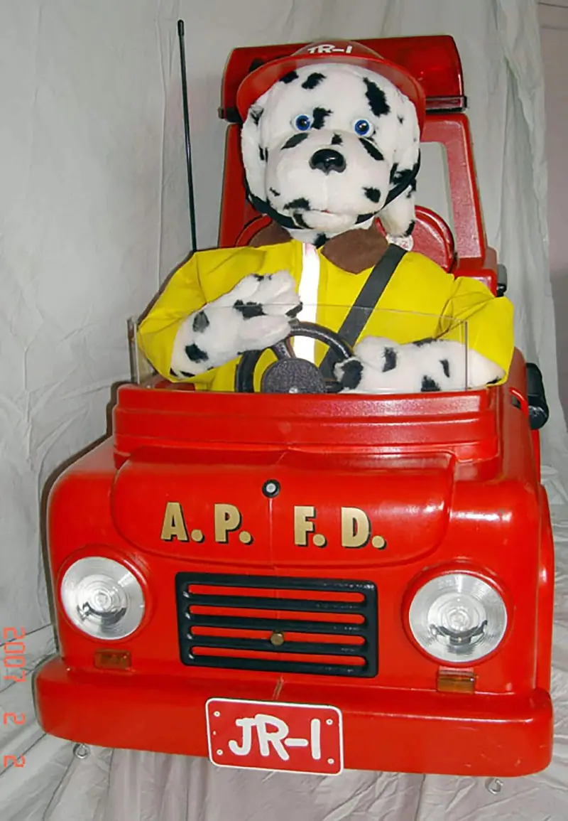 Toy fire truck with a Dalmatian plush – Holiday Santa Visits in Orlando, FL